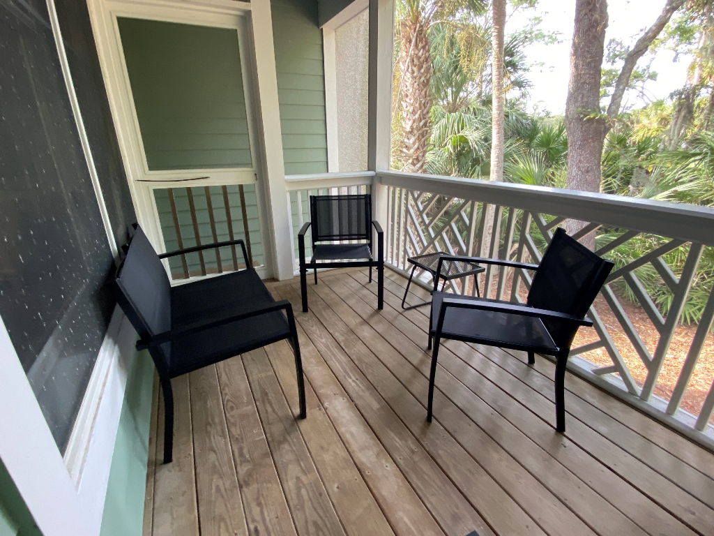 Screened porch with new furniture and ceiling fan