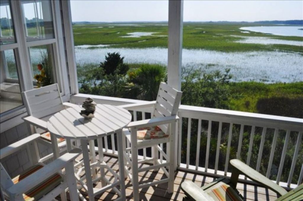 Two screened decks offer this peaceful endless view over the waterway and marsh