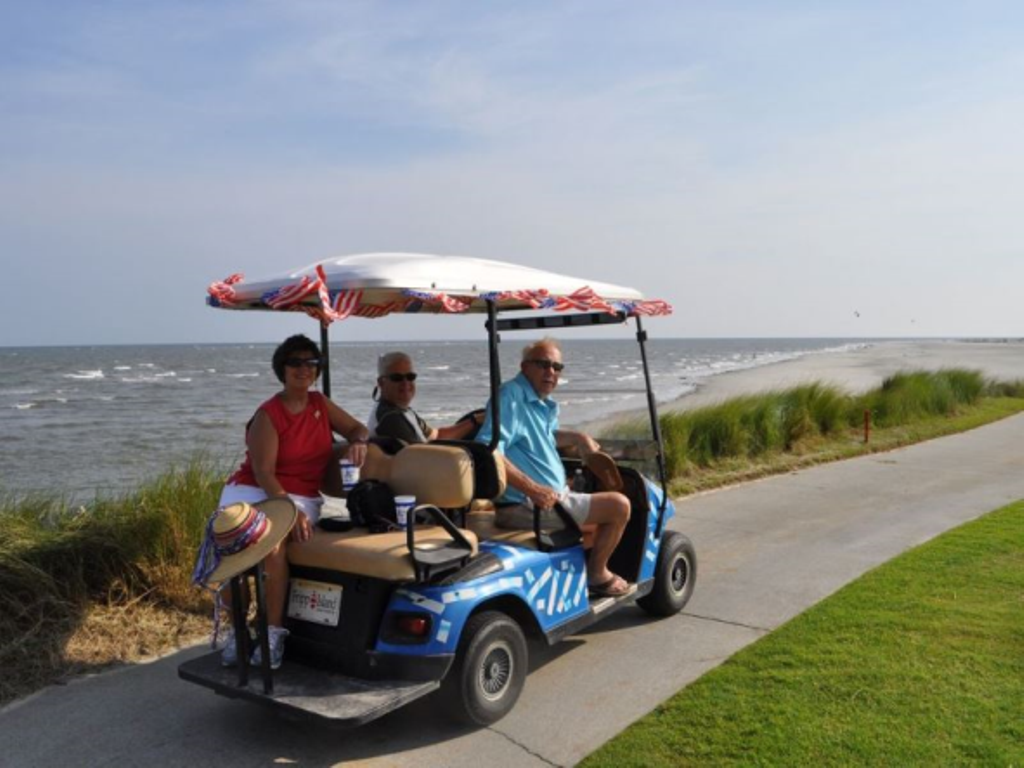 Our comfortable and custom painted golf cart comes free with your weekly rental