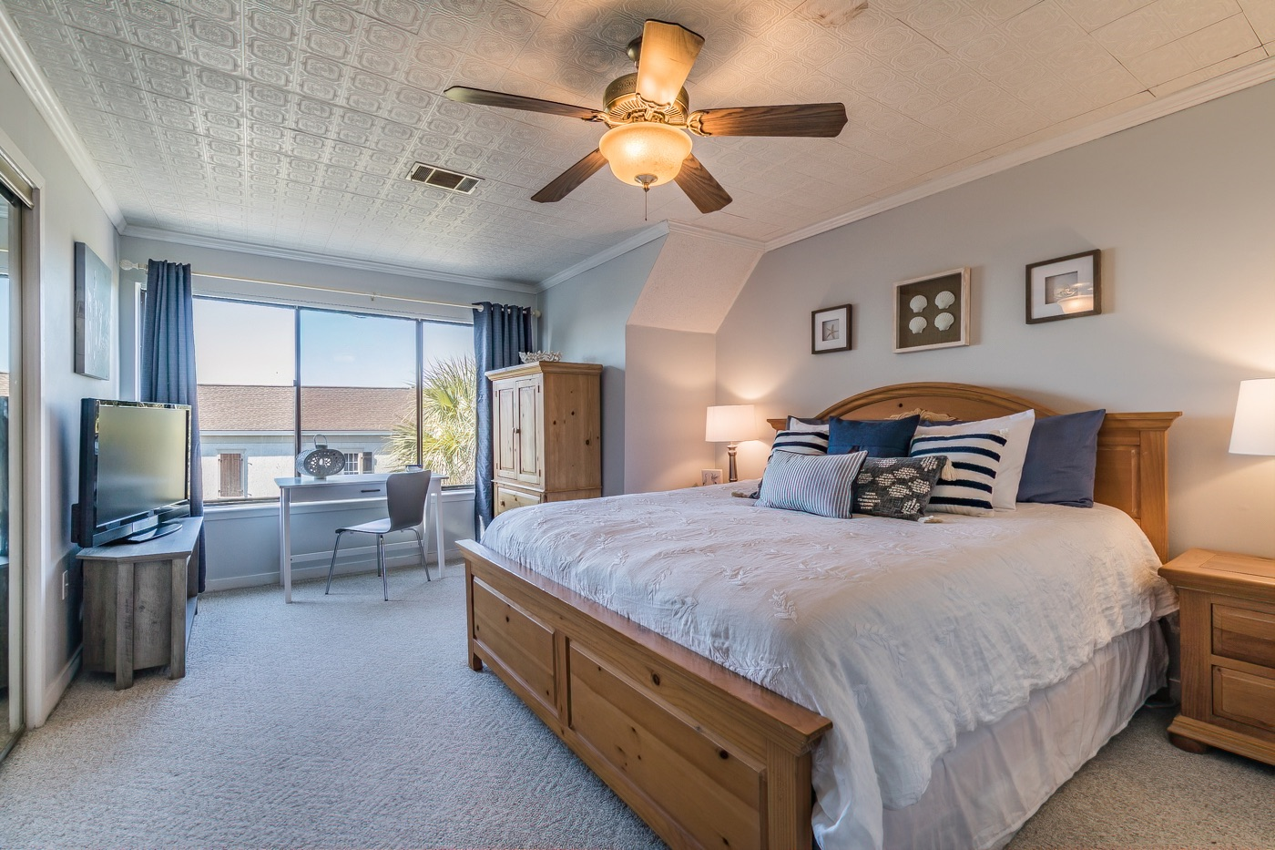 Elegantly comfortable Master Bedroom includes stunning views of the ocean and pool